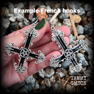 These gorgeous gothic earrings feature a black enamel inverted cross with a silver inverted pentagram, measuring just on 8.5 cms from tip to tip, and weigh approx 10 grams a piece.

This pair have been made on stainless steel french hooks, suitable for pierced ears.