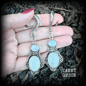 These gemstone earrings feature beautiful big rainbow moonstones in a beautiful antique silver setting.  These earrings are lovely and dangly measuring 8cms from tip to tip, and weighing 14 grams each. Made on 2 gauge (6mm) surgical steel full curls.