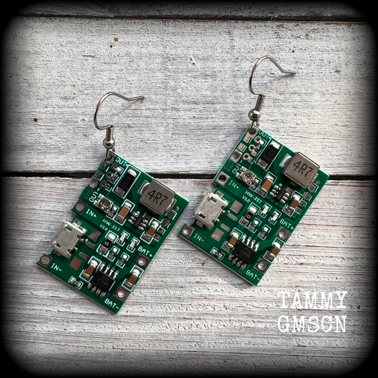 These awesome cyberpunk circuit board earrings measure just under 6 cms from tip to tip, and weigh only a few grams each, these are lovely and lightweight and not too dangly.

This pair has been made on stainless steel french hooks, to be worn in pierced ears.