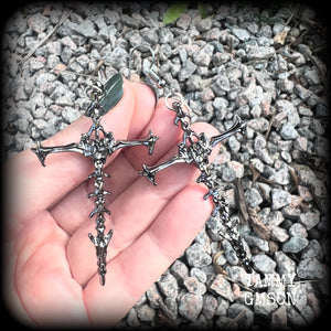 These gorgeous gothic earrings feature gunmetal grey skeleton crosses, measuring just over 8 cms from tip to tip, and weigh approx 7 grams a piece.

This pair have been made on stainless steel french hooks, suitable for pierced ears.