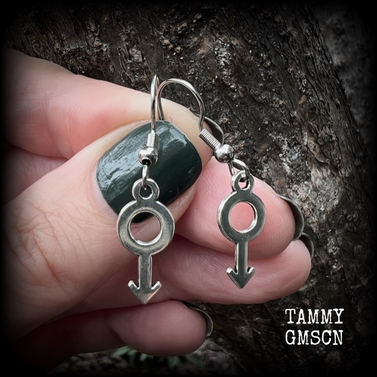 This pair of earrings features antique silver Male/Mars symbols, are nice and lightweight (at a gram or two each), measuring approx 3.5cms from tip to tip.

This pair has been made on stainless steel french hooks, for pierced ears.