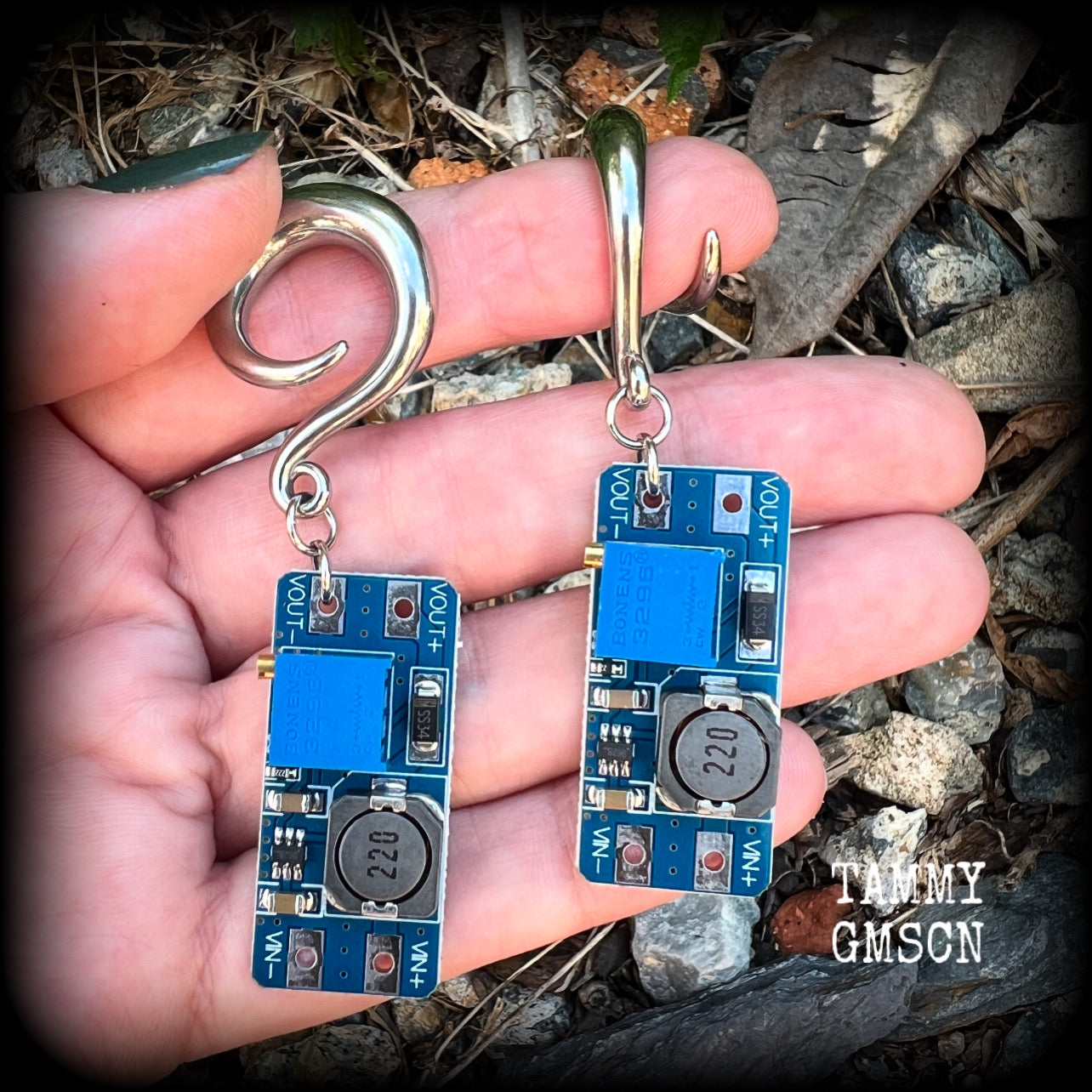 These awesome earrings feature pieces of blue circuitry, are nice and dangly, measuring just on 7cms from tip to tip, and nice and light weight, weighing approx 12 grams each.

This pair has been made on 2 gauge (6mm) surgical steel full curl hooks, to be worn in stretched lobes.