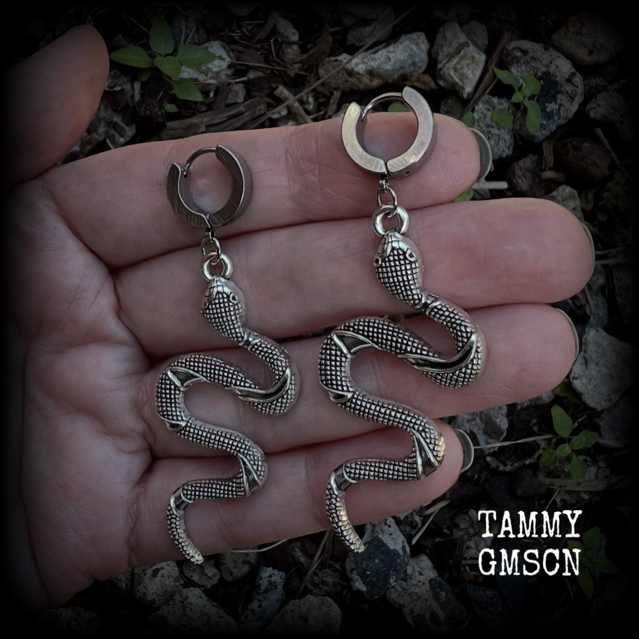 These awesome earrings feature an antique silver snake, are nice and lightweight at 7 grams each, and measure in at approx 7cms from tip to tip.

This pair have been made on stainless steel huggie ear cuffs, suitable for pierced ears.