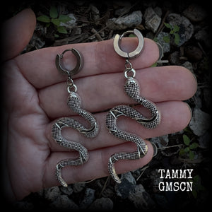 These awesome earrings feature an antique silver snake, are nice and lightweight at 7 grams each, and measure in at approx 7cms from tip to tip.

This pair have been made on stainless steel huggie ear cuffs, suitable for pierced ears.