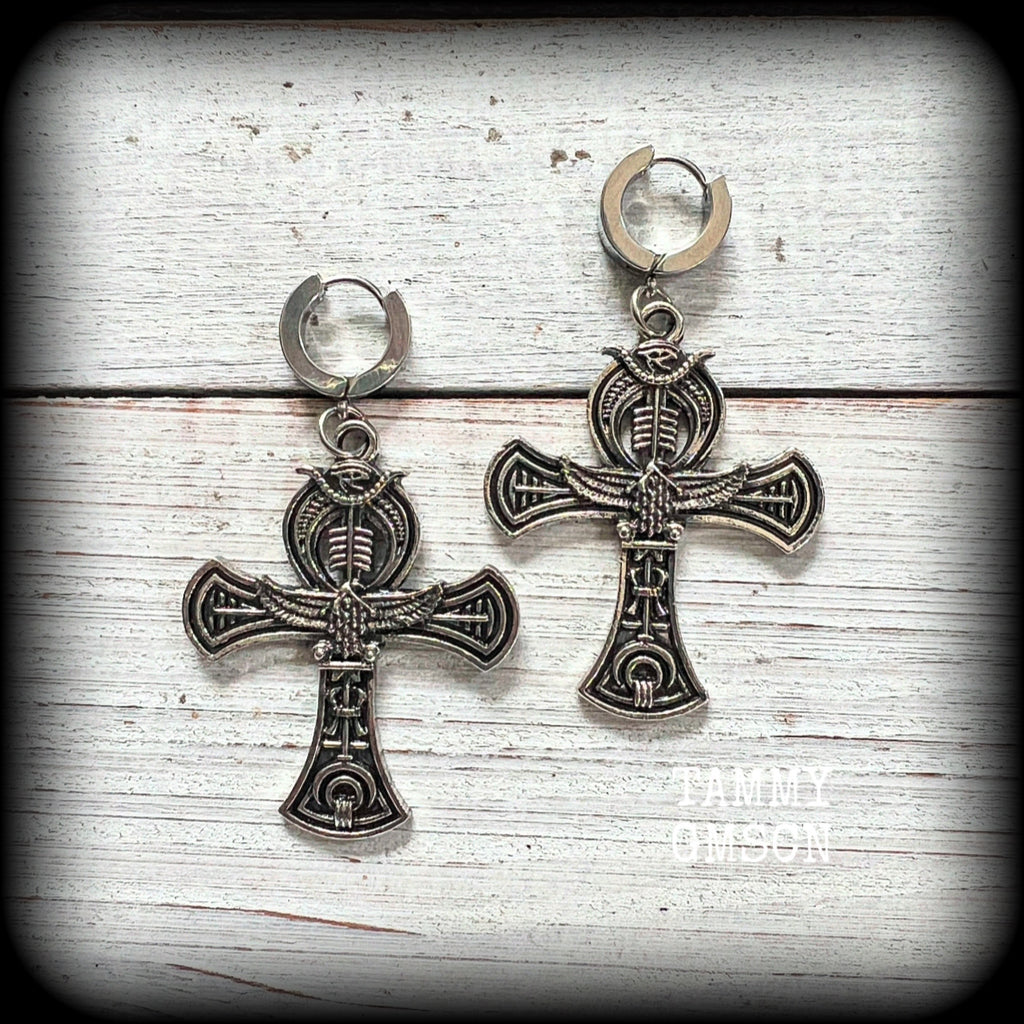 These gorgeous antique silver Egyptian ankh cross earrings measure just on 6cms from tip to tip, and are nice and light weight, at 8 grams each.

This pair have been made on stainless steel huggies-suitable for pierced ears. 