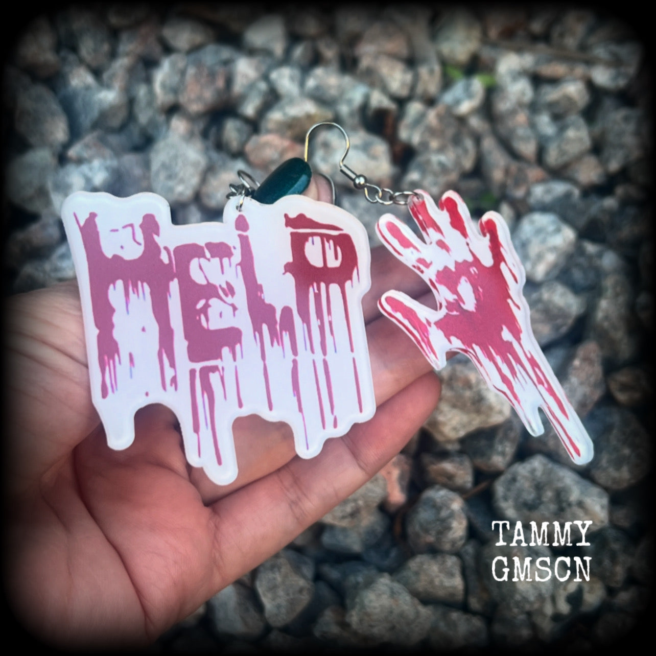 These awesome horror movie inspired earrings feature a bloodied hand print alongside ‘HELP’ finger painted in blood, measuring approx 7.5cms from tip to tip, and weigh only a few grams each.

This pair has been made with stainless steel french hooks, suitable for pierced ears.