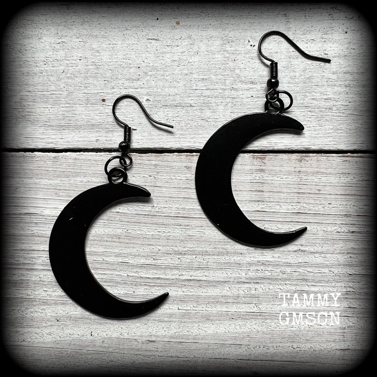 Featuring large black enamel crescent moons, these stunning crescent moon earrings measure just under 7cms from tip to tip and are nice and light weight at approx 5 grams each.

This pair has been made with french hooks, for pierced ears.