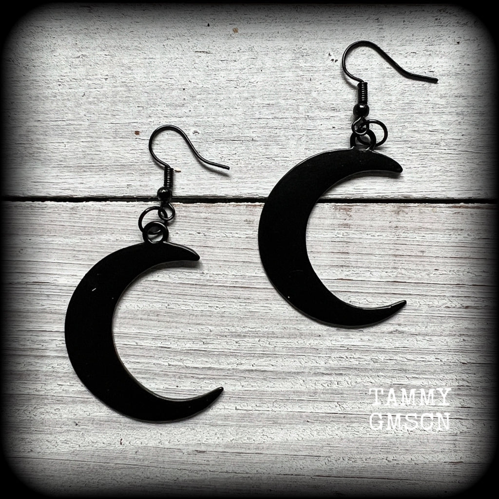 Featuring large black enamel crescent moons, these stunning crescent moon earrings measure just under 7cms from tip to tip and are nice and light weight at approx 5 grams each.

This pair has been made with french hooks, for pierced ears.