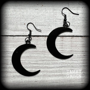 Featuring large black enamel crescent moons, these stunning crescent moon earrings measure just under 7cms from tip to tip and are nice and light weight at approx 5 grams each.

This pair has been made with french hooks, for pierced ears.