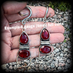 These stunning dangly gauged earrings feature gorgeous deep red faceted garnet gemstones in an ornate antique silver hinged setting, measuring just over 8cms from tip to tip, and weigh approx 10 grams each.  This pair have been made with 6 gauge (4mm) surgical steel full curl hooks, to be worn in stretched lobes.