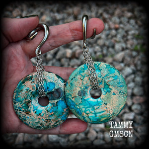 These ear weights feature gorgeous Turquoise ocean jasper donut gemstones cradled in antique silver chain, measuring just over 9cms from tip to tip, and weighing approx 40 grams each. 

This pair have been made on 2 gauge (6mm) surgical steel full curls, to be worn in stretched lobes.
