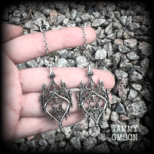 These gorgeous gothic earrings feature a beautiful antique silver ornate gothic cathedral architectural arch, measuring just on 8.5cms from tip to tip, and weighing approx 7 grams each.

 💥This listing includes one pair of surgical steel single flared O-ring earlets