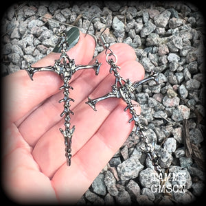 These gorgeous gothic earrings feature gunmetal grey skeleton crosses, measuring just over 8 cms from tip to tip, and weigh approx 7 grams a piece.

This pair have been made on stainless steel french hooks, suitable for pierced ears.