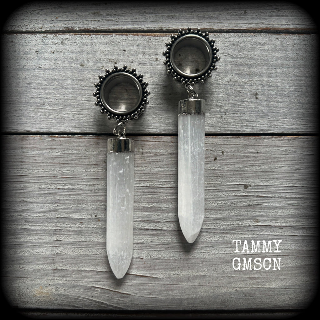 These unique earrings have been made with beautiful rustic Selenite points, weighing approx 15grams each and measuring approx 8.5cms from tip to tip.

This pair has been made with 9/16" (14mm) gauge ornate surgical steel screw fit tunnels.