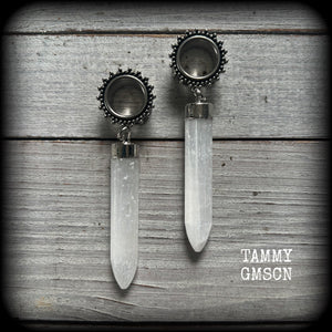 These unique earrings have been made with beautiful rustic Selenite points, weighing approx 15grams each and measuring approx 8.5cms from tip to tip.

This pair has been made with 9/16" (14mm) gauge ornate surgical steel screw fit tunnels.