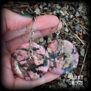This is a pair of gorgeous ear hangers featuring dusty pink and chocolate brown Rhodonite gemstone donuts cradled in antique silver chain, weighing approx 23grams a piece, and measuring just under 7 cms from tip to tip.

This pair has made with small antique silver shephards hooks, to be worn with silicone earlets in stretched lobes from 8gauge (3mm).