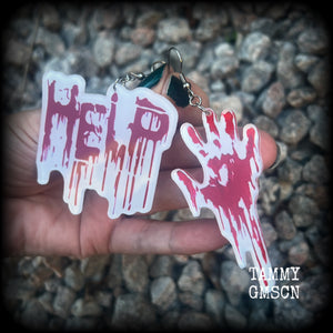 These awesome horror movie inspired earrings feature a bloodied hand print alongside ‘HELP’ finger painted in blood, measuring approx 7.5cms from tip to tip, and weigh only a few grams each.

This pair has been made with stainless steel french hooks, suitable for pierced ears.