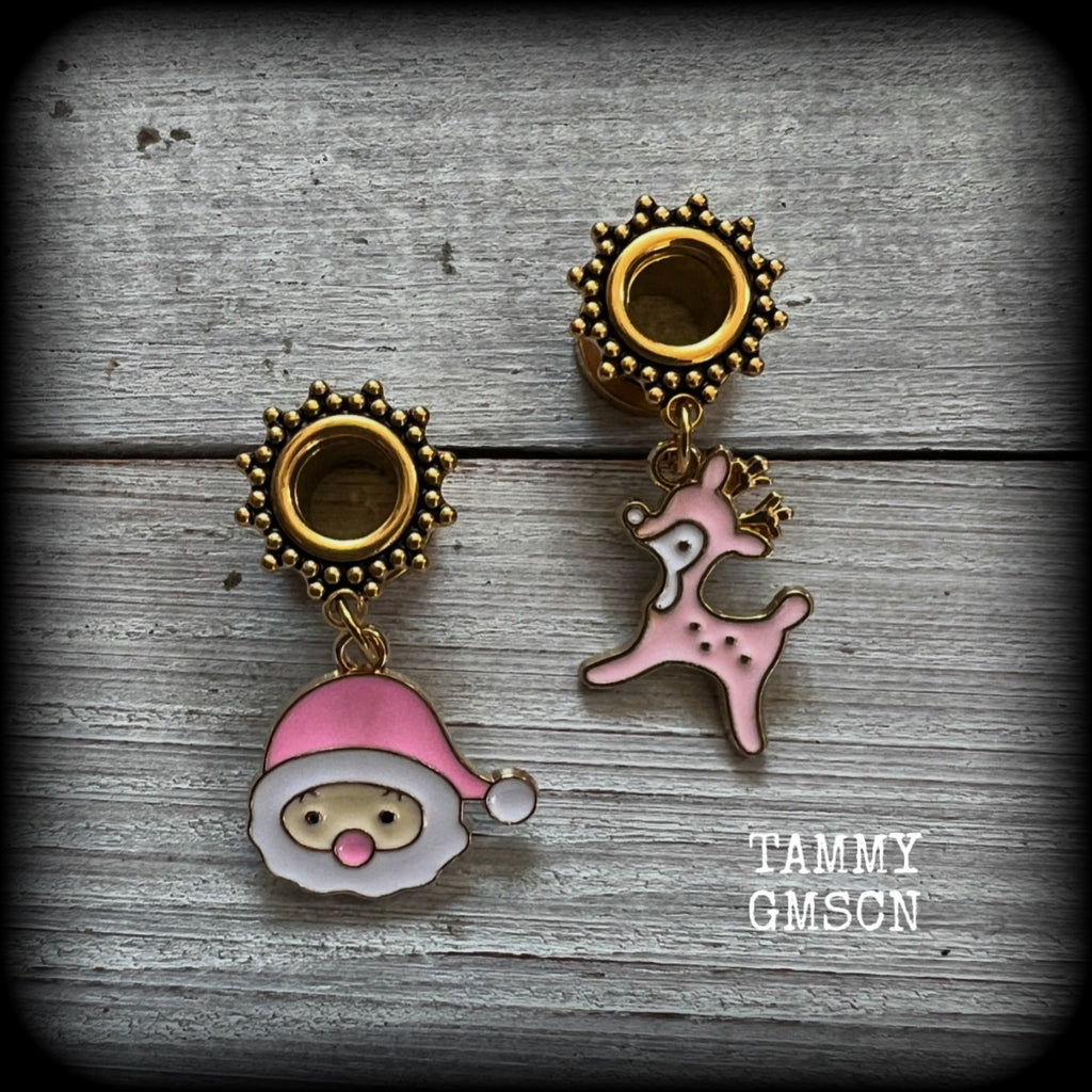 These festive tunnel earrings feature gorgeous pink and white enamel Santa Claus and reindeer charms, are nice and lightweight at only 5 grams each and measure approx 4cms from tip to tip.

This pair has been made on 0 gauge (8mm) gauge ornate surgical steel screw fit tunnels-for stretched lobes.
