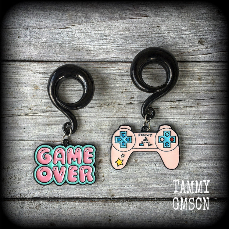 These awesome 'Game Over' gauged earrings are cute and quirky, measuring just over 6cms from tip to tip and weighing 20 grams a piece.

This pair has been made on 00 gauge (10mm) surgical steel full curl hooks, to be worn in stretched lobes.