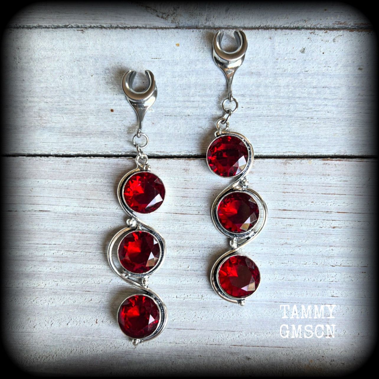 ♥️ Garnet is the birthstone for January, ans is often associated with good health, happiness, confidence, and mental clarity. 

These beautiful gauged earrings feature gorgeous deep red faceted garnet gemstones in an ornate antique silver setting, measuring 8cms from tip to tip, and weighing approx 10 grams each, nice and light weight.

These earrings have been made on 0 gauge (8mm) surgical steel cradles, to be worn in stretched lobes.
