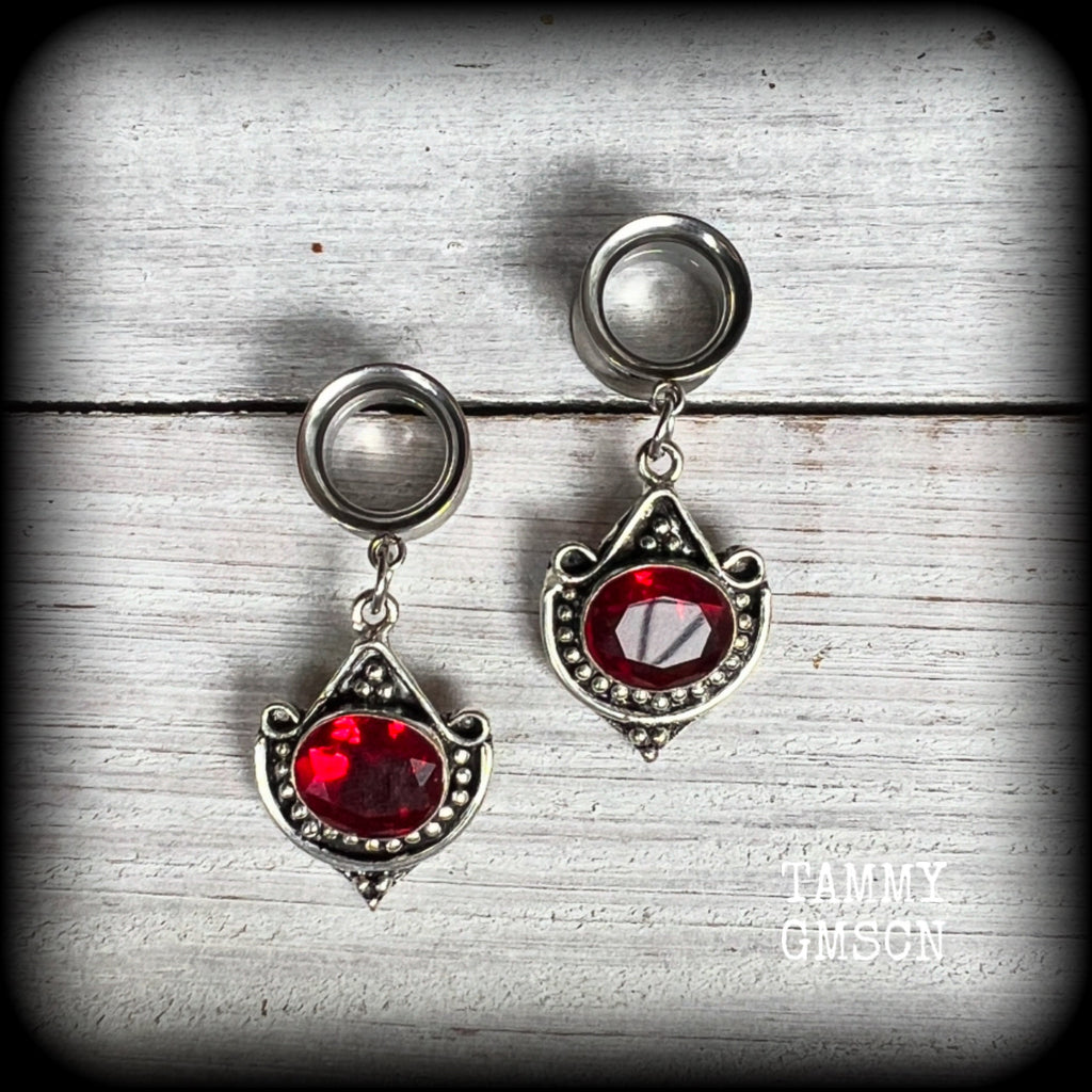 These beautiful earrings have been made with gorgeous deep red garnet gemstones in a beautiful boho antique silver setting, are nice and light weight, weighing approx 6 grams each and measuring 4.5 from tip to tip.

These gorgeous tunnel dangles have been made with 1/2" (12mm) gauge surgical steel screw fit earlets.