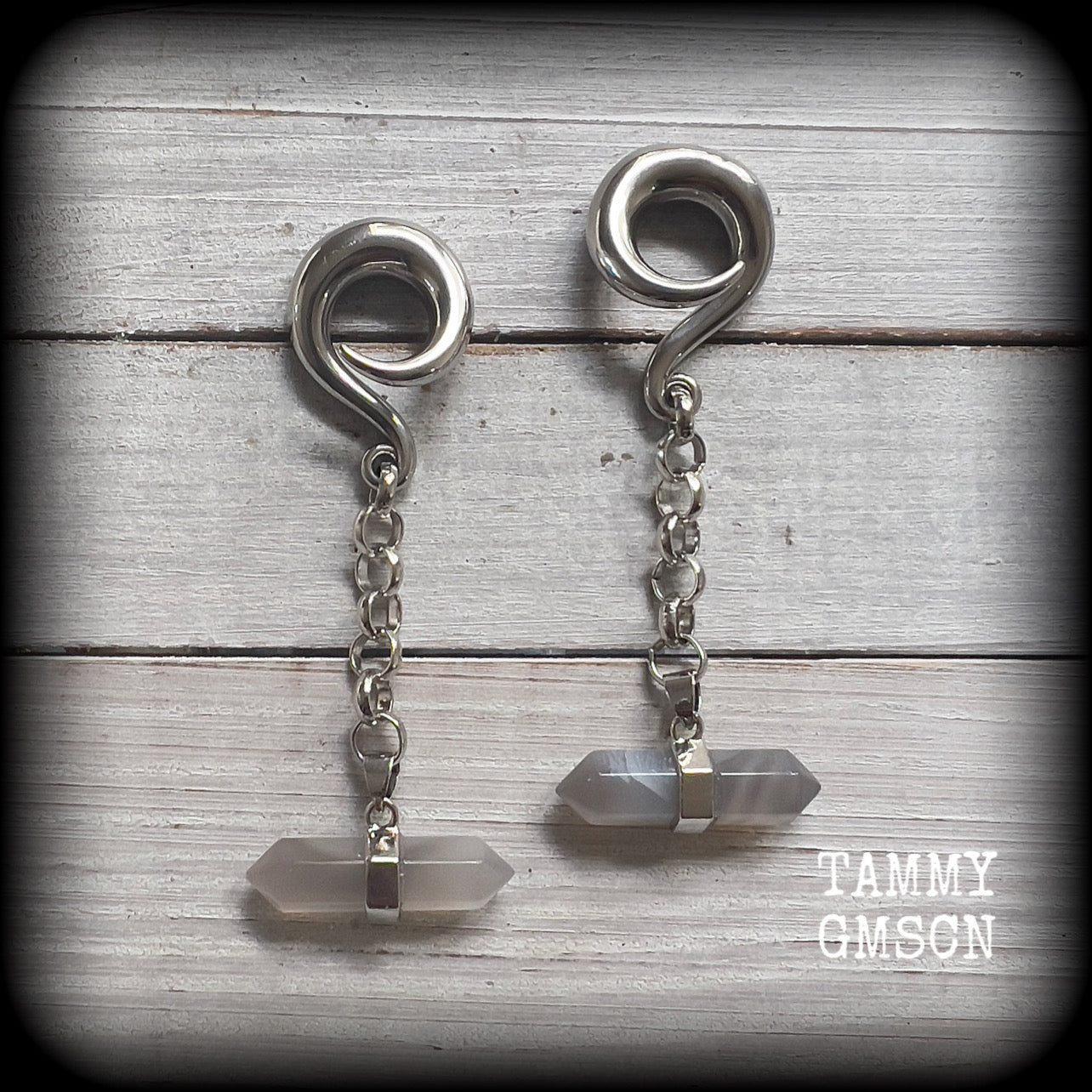 Featuring gorgeous milky grey agate gemstones hanging from chunky antique silver chains, these earrings weigh in at 20 grams a piece, and are nice and dangly measuring 9 cms from tip to tip

This pair has been made on 0 gauge (8mm) surgical steel full curl hooks, to be worn in stretched lobes.