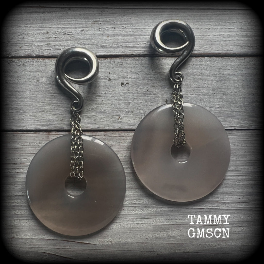 Featuring a pair of gorgeous grey agate donuts, these gauged earrings weigh in at approx 35 grams each, and measuring just on 10 cms from tip to tip.

This pair has been made with 0 gauge (8mm) surgical steel full curl hooks, suitable for stretched lobes. 