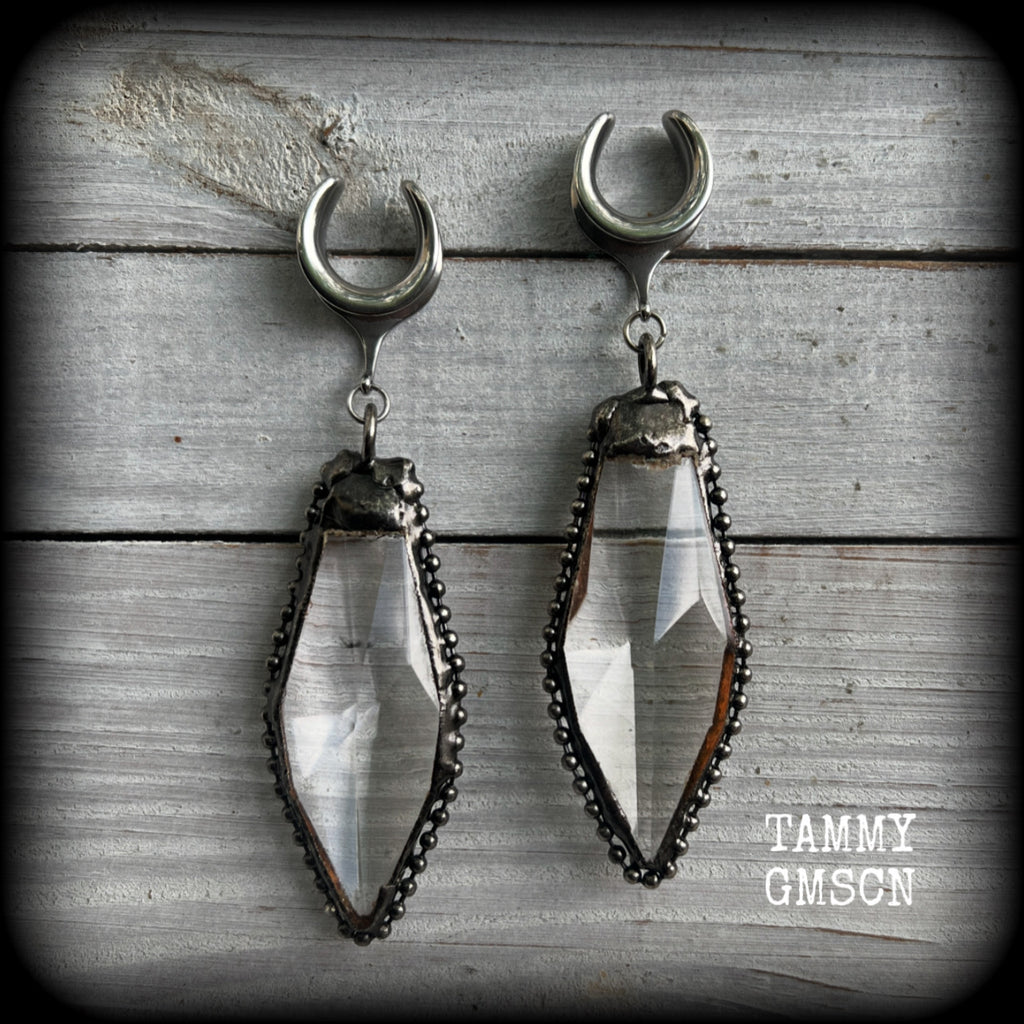 These gorgeous dangly glass earrings have been made with gorgeous chunky faceted clear glass pieced, measuring 10.5 cms from tip to tip, and weighing approx 26 grams each.

These earrings have been made on 5/8" gauge (16mm) surgical steel cradles, to be worn in stretched lobes.