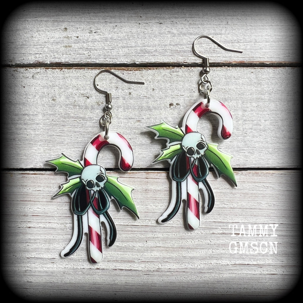 These spooky cute earrings feature a classic candy cane with holly and skull tied in a bow!
Super cute and super lightweight, these earrings weigh only a few grams each and are nice and dangly, measuring just on 8 cms from tip to tip.

This pair has been made on stainless steel french hooks, suitable for pierced ears.