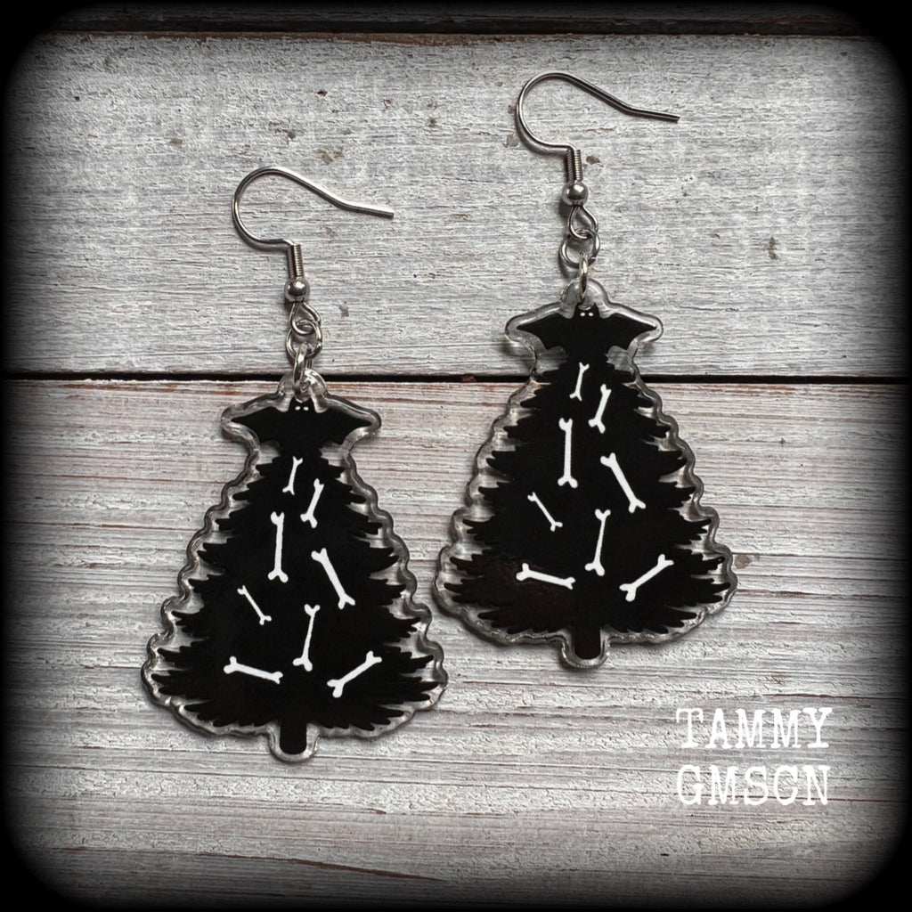 These adorable black gothic Creepmas Christmas tree earrings are decorated with bones and topped with a spooky black bat!!

These earrings are nice and dangly, measuring 7cms from tip to tip and nice and lightweight, weighing only a few grams each.

This pair has been made on stainless steel french hooks, suitable for pierced ears.
