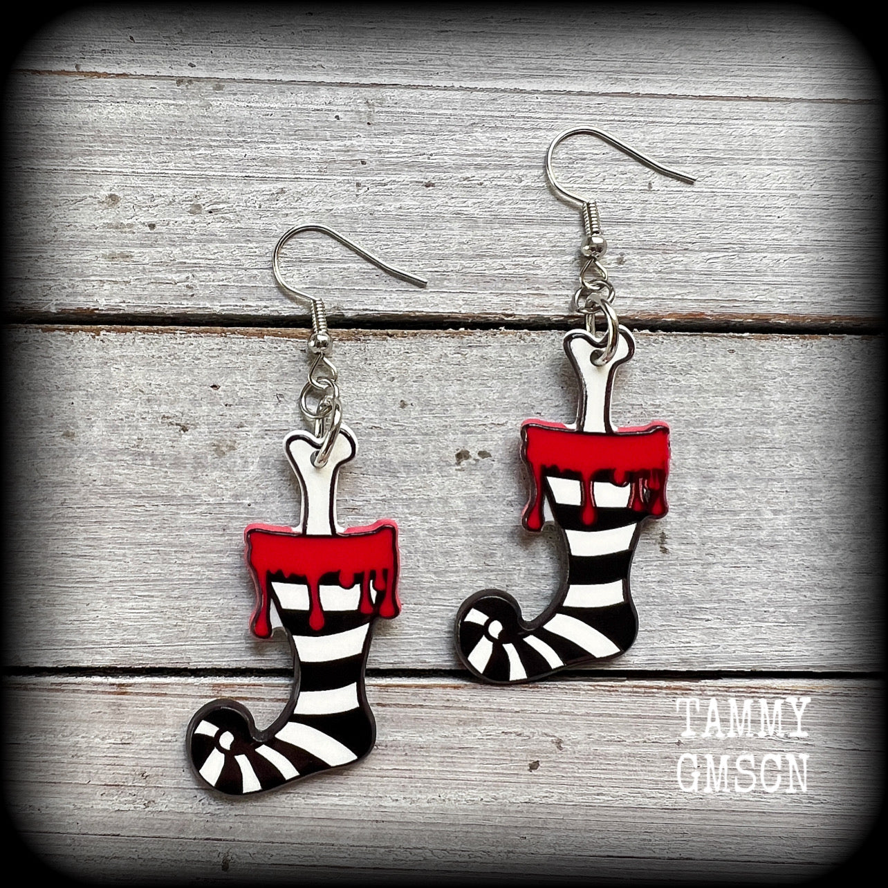Featuring a festive acrylic stripey stocking complete with gory leg bone poking out,these awesome Santa stocking earrings are super lightweight, weighing only a few grams each and are nice and dangly, measuring just under 7 cms from tip to tip.

This pair has been made on stainless steel french hooks, suitable for pierced ears.