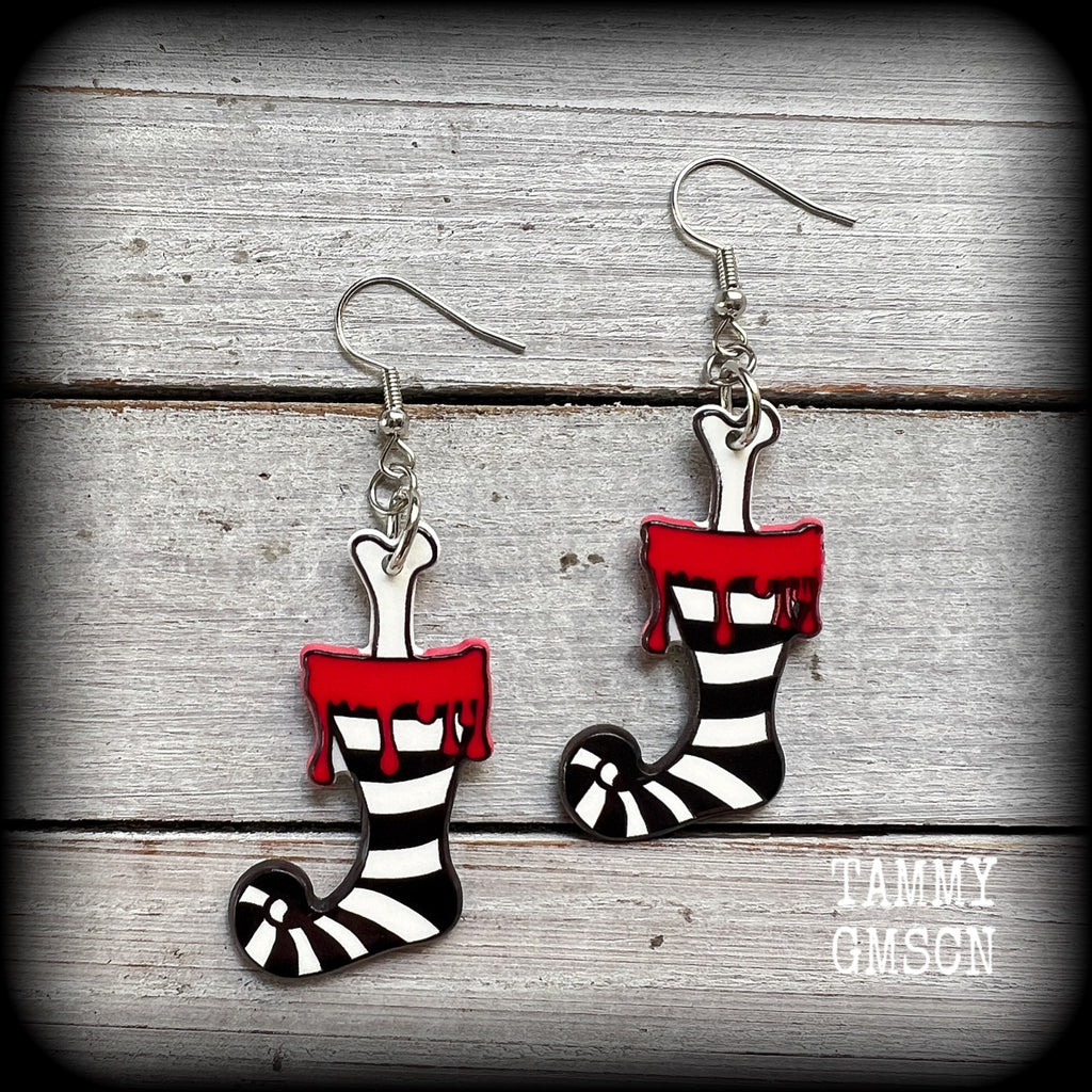Featuring a festive acrylic stripey stocking complete with gory leg bone poking out,these awesome Santa stocking earrings are super lightweight, weighing only a few grams each and are nice and dangly, measuring just under 7 cms from tip to tip.

This pair has been made on stainless steel french hooks, suitable for pierced ears.