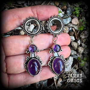 These gorgeous tunnel earrings have been made with beautiful polished amethyst gemstones in gorgeous antique silver boho settings.
These earrings are beautifully light weight, weighing approx 13 grams each and measure just on 6cms from tip to tip.

This pair have been made with 9/16” gauge (14mm) ornate surgical steel screw fit tunnels.