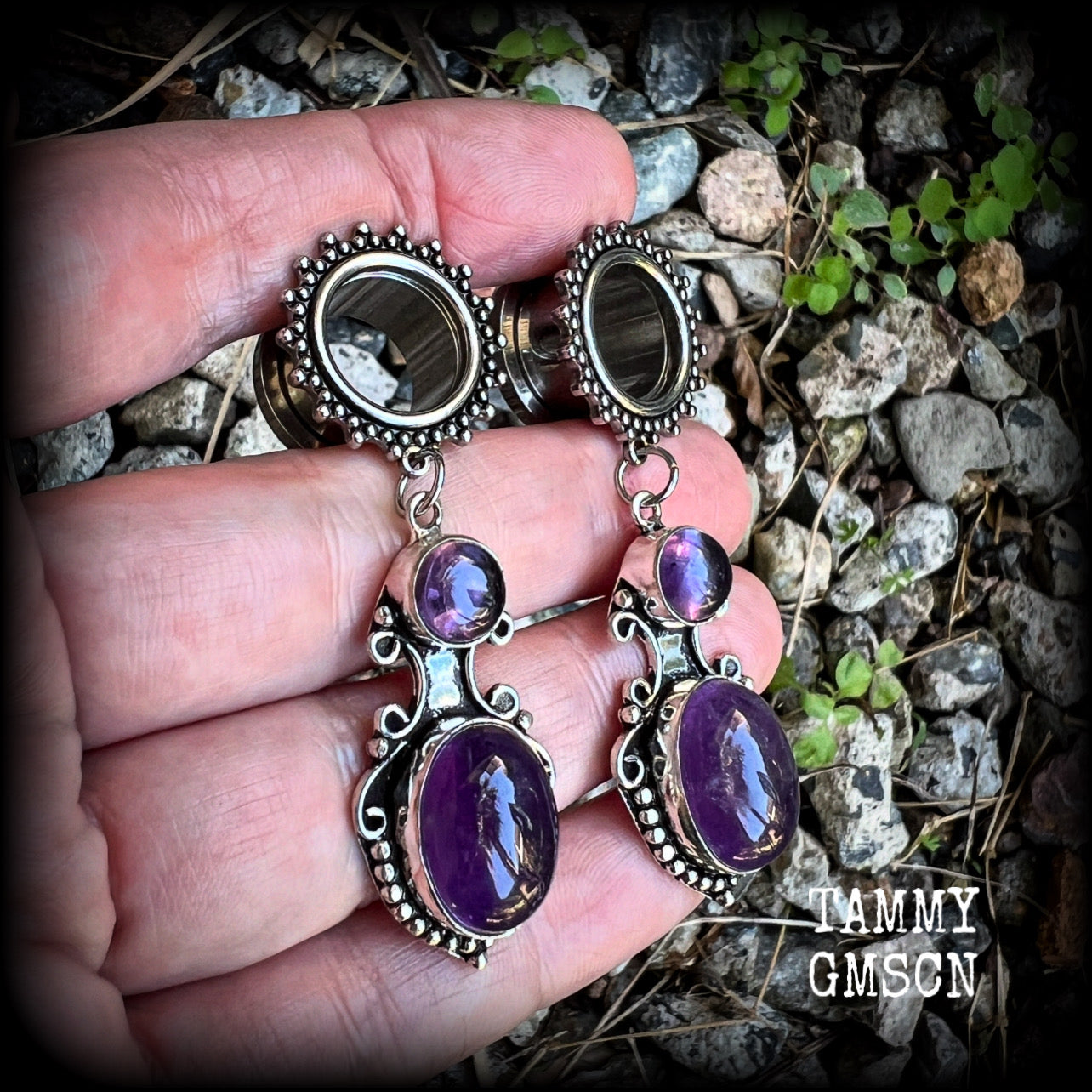 These gorgeous tunnel earrings have been made with beautiful polished amethyst gemstones in gorgeous antique silver boho settings.
These earrings are beautifully light weight, weighing approx 13 grams each and measure just on 6cms from tip to tip.

This pair have been made with 9/16” gauge (14mm) ornate surgical steel screw fit tunnels.