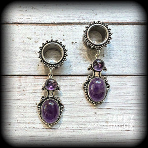 These gorgeous tunnel earrings have been made with beautiful polished amethyst gemstones in gorgeous antique silver boho settings.
These earrings are beautifully light weight, weighing approx 13 grams each and measure just on 6cms from tip to tip.

This pair have been made with 9/16” gauge (14mm) ornate surgical steel screw fit tunnels.