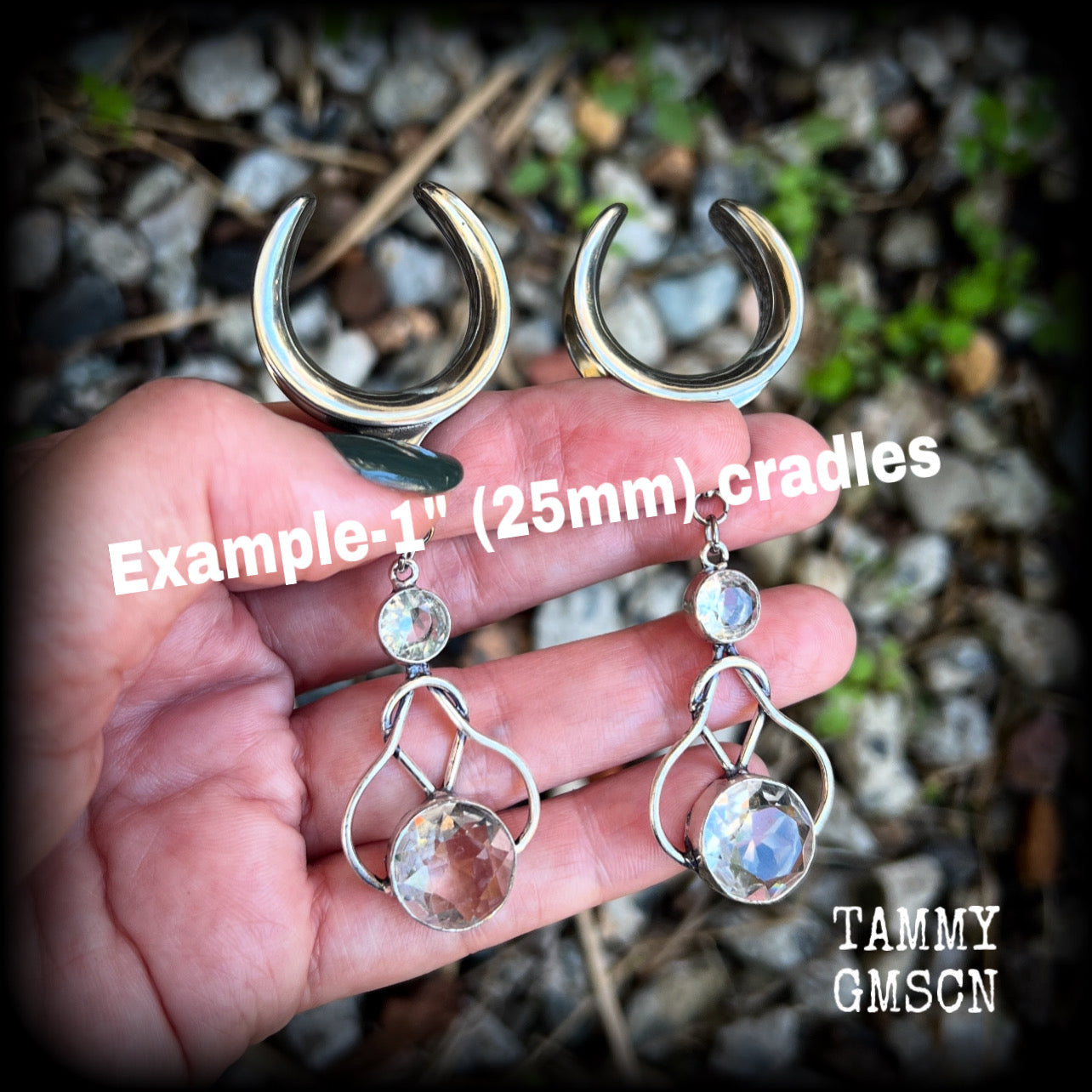 Featuring shimmering clear topaz gemstones in a beautiful antique silver knotwork setting, these gorgeous earrings weigh in at 14 grams a piece, and are nice and dangly at just under 9cms from tip to tip.

This pair has been made on 1” gauge (25mm) surgical steel cradles, suitable for stretched lobes.