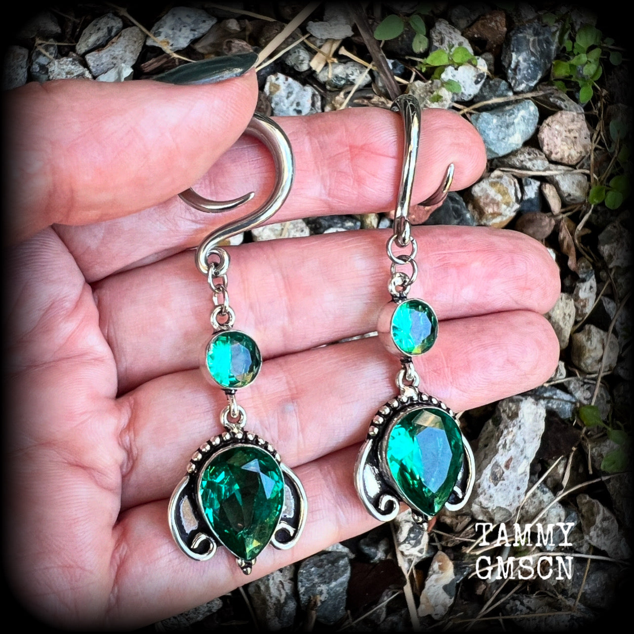 These earrings have been made with gorgeous green topaz gemstones in a lovely boho antique silver setting, lovely and dangly at 7cms from tip to tip, and weighing approx 13 grams each.

These earrings have been made on 6 gauge (4mm) surgical steel full curl hooks, to be worn in stretched lobes.