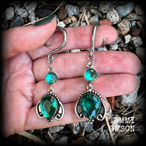 These earrings have been made with gorgeous green topaz gemstones in a lovely boho antique silver setting, lovely and dangly at 7cms from tip to tip, and weighing approx 13 grams each.

These earrings have been made on 6 gauge (4mm) surgical steel full curl hooks, to be worn in stretched lobes.