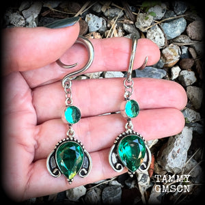 These earrings have been made with gorgeous green topaz gemstones in a lovely boho antique silver setting, lovely and dangly at 7cms from tip to tip, and weighing approx 13 grams each.

These earrings have been made on 6 gauge (4mm) surgical steel full curl hooks, to be worn in stretched lobes.