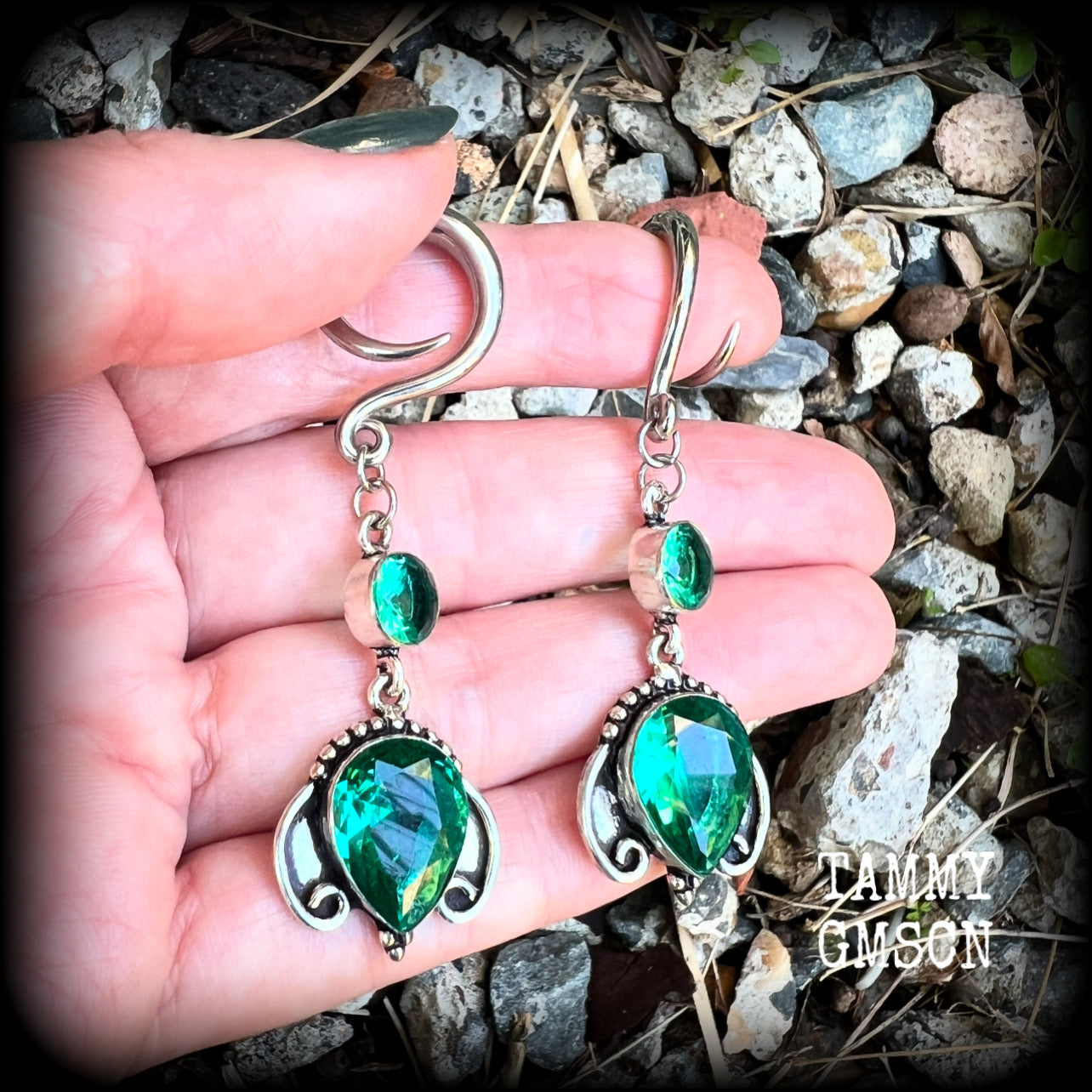These earrings have been made with gorgeous green topaz gemstones in a lovely boho antique silver setting, lovely and dangly at 7cms from tip to tip, and weighing approx 13 grams each.

These earrings have been made on 6 gauge (4mm) surgical steel full curl hooks, to be worn in stretched lobes.