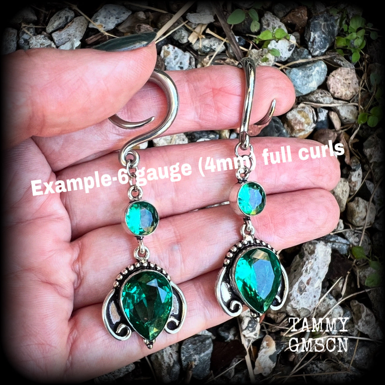 These earrings have been made with gorgeous green topaz gemstones in a lovely boho antique silver setting, lovely and dangly at 7cms from tip to tip, and weighing approx 13 grams each.

These earrings have been made on 6 gauge (4mm) surgical steel full curl hooks, to be worn in stretched lobes.