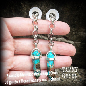 These earrings feature gorgeous turquoise sea sediment jasper pendulums, measuring just on 8cms from tip to tip, and are nice and light weight, weighing only 8 grams each.

This pair has been made with our chunky antique silver chain/lobster clasp 10mm option, suitable to be worn in stretched lobes with silicone earlets from 00 gauge (10mm).
