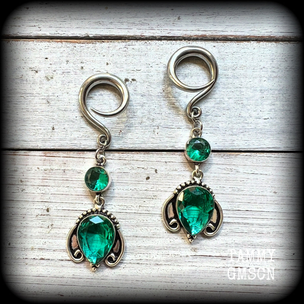 These earrings have been made with gorgeous green topaz gemstones in a lovely boho antique silver setting, lovely and dangly at 7cms from tip to tip, and weighing approx 13 grams each.

These earrings have been made on 6 gauge (4mm) surgical steel full curl hooks, to be worn in stretched lobes.