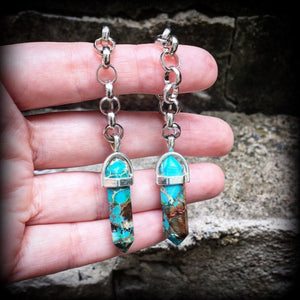 These earrings feature gorgeous turquoise sea sediment jasper pendulums, measuring just on 8cms from tip to tip, and are nice and light weight, weighing only 8 grams each.

This pair has been made with our chunky antique silver chain/lobster clasp 10mm option, suitable to be worn in stretched lobes with silicone earlets from 00 gauge (10mm).