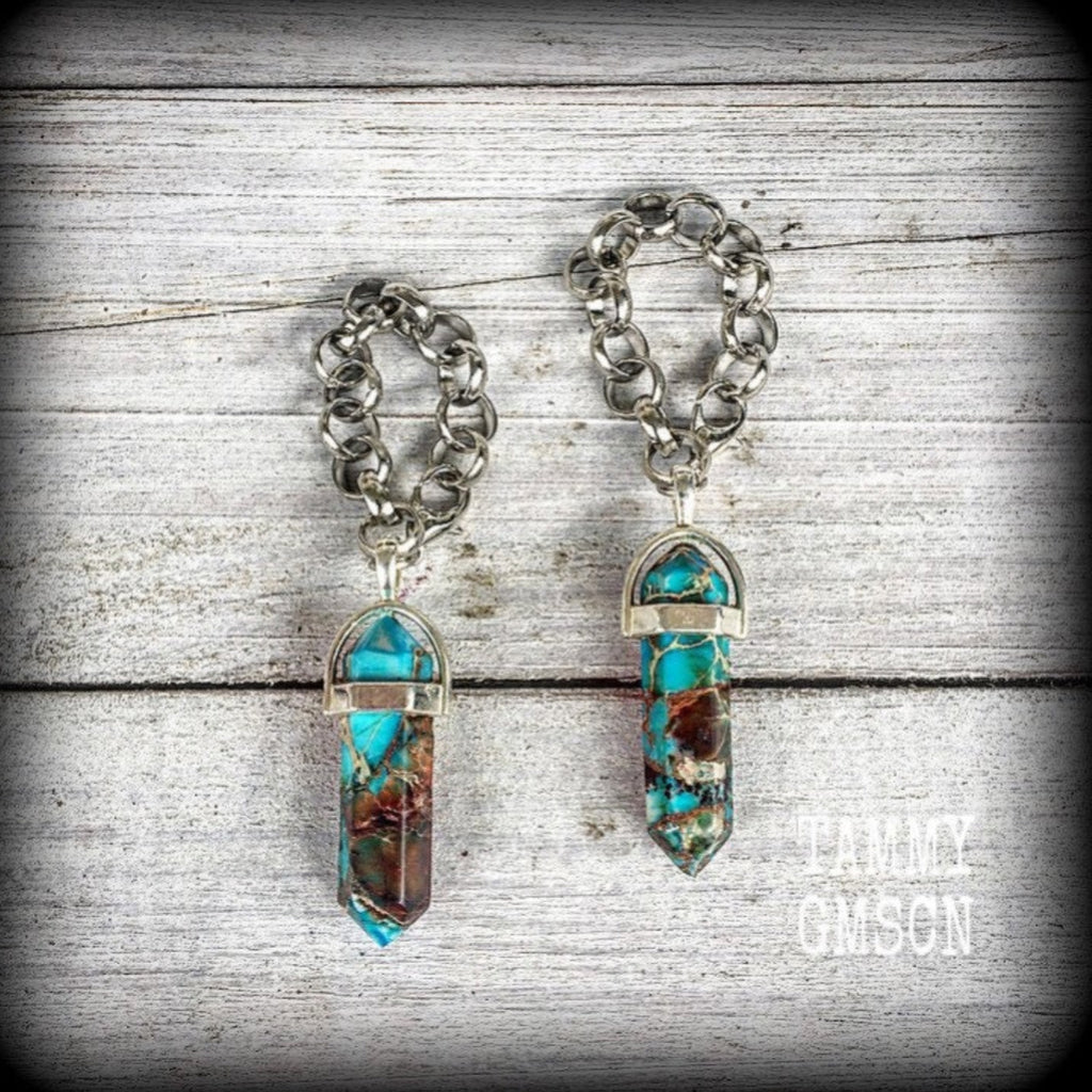 These earrings feature gorgeous turquoise sea sediment jasper pendulums, measuring just on 8cms from tip to tip, and are nice and light weight, weighing only 8 grams each.

This pair has been made with our chunky antique silver chain/lobster clasp 10mm option, suitable to be worn in stretched lobes with silicone earlets from 00 gauge (10mm).