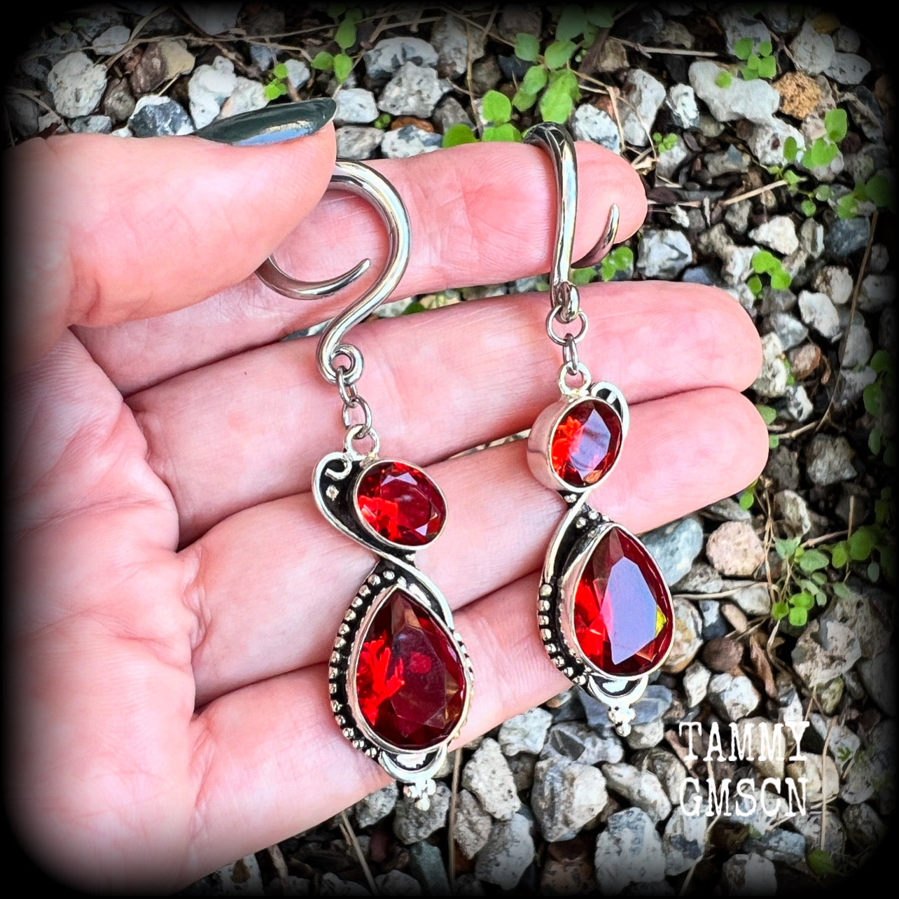 These gorgeous gypsy boho gauged earrings have been made with deep red faceted garnet gemstones in an ornate antique silver setting, measuring just over 7cms from tip to tip, and weighing approx 9 grams each, nice and light weight.

These earrings have been made on 6 gauge (4mm) surgical steel full curl hooks, to be worn in stretched lobes.