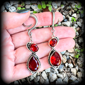 These gorgeous gypsy boho gauged earrings have been made with deep red faceted garnet gemstones in an ornate antique silver setting, measuring just over 7cms from tip to tip, and weighing approx 9 grams each, nice and light weight.

These earrings have been made on 6 gauge (4mm) surgical steel full curl hooks, to be worn in stretched lobes.