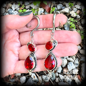 These gorgeous gypsy boho gauged earrings have been made with deep red faceted garnet gemstones in an ornate antique silver setting, measuring just over 7cms from tip to tip, and weighing approx 9 grams each, nice and light weight.

These earrings have been made on 6 gauge (4mm) surgical steel full curl hooks, to be worn in stretched lobes.