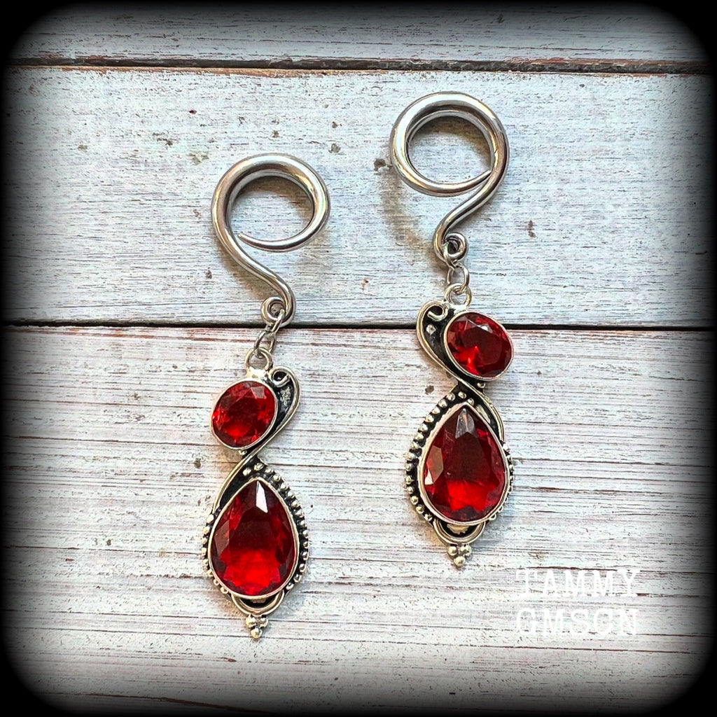 These gorgeous gypsy boho gauged earrings have been made with deep red faceted garnet gemstones in an ornate antique silver setting, measuring just over 7cms from tip to tip, and weighing approx 9 grams each, nice and light weight.

These earrings have been made on 6 gauge (4mm) surgical steel full curl hooks, to be worn in stretched lobes.