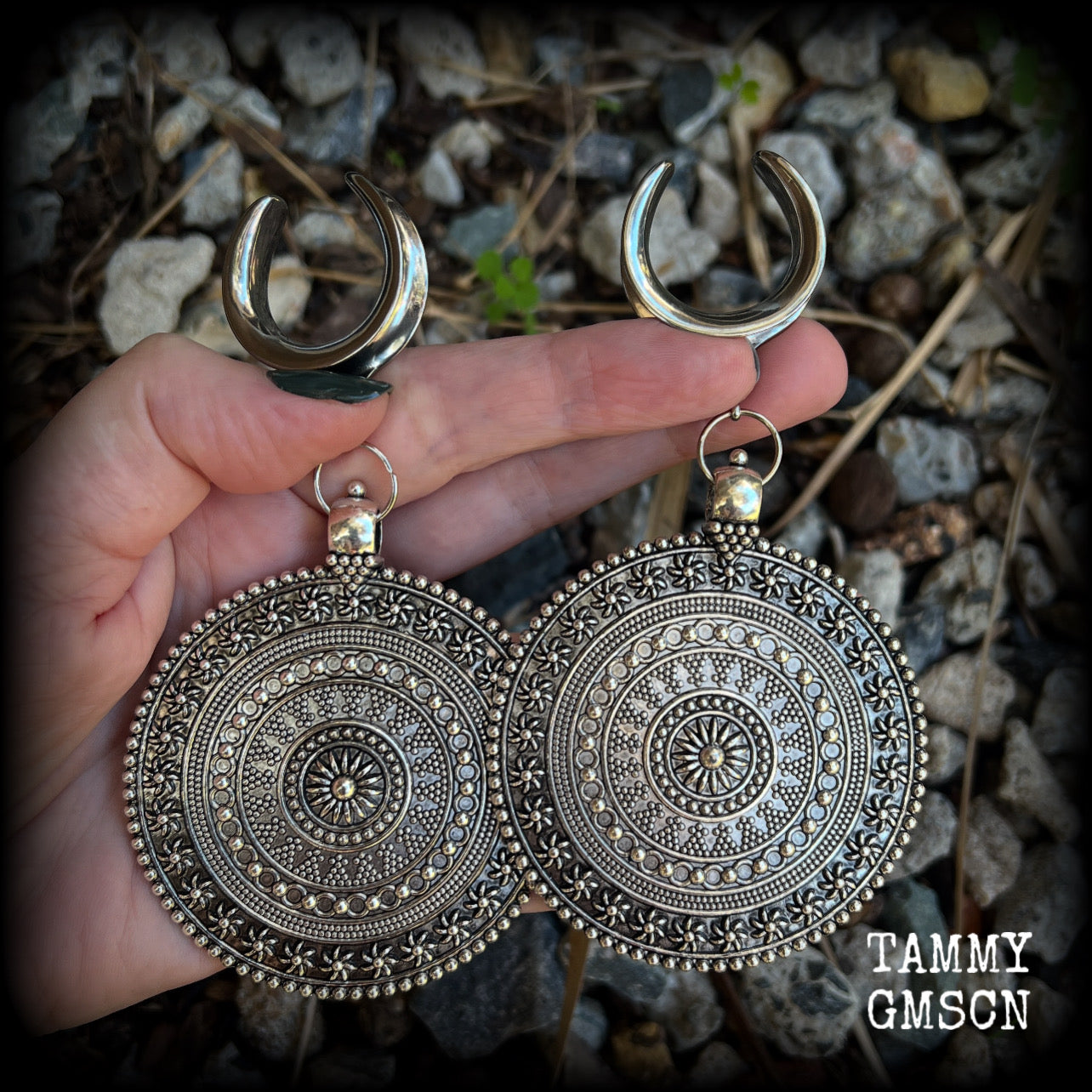 These big beautiful antique silver mandala gauged earrings are gorgeous!! Weighing in at approx 33grams a piece, measuring just on 12cms from tip to tip, this pair of gauged earrings are lovely and dangly but not too heavy.

This pair have been made on 1” gauge (25mm) surgical steel cradles, suitable for stretched lobes.

